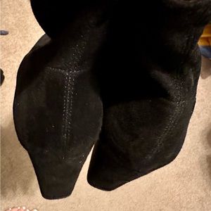 Short black suede boots with heel. Never worn.